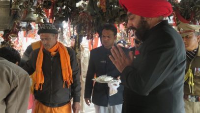 Governor offering prayers at Golu Devta Ghorakhal temple.