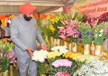 Governor and Chief Minister Pushkar Singh Dhami observing the flower exhibition on the occasion of Vasantotsav-2023 at Raj Bhawan.;?>