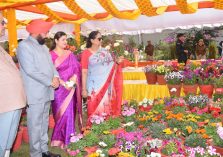 Governor and Chief Minister Pushkar Singh Dhami observing the flower exhibition on the occasion of Vasantotsav-2023 at Raj Bhawan.;?>