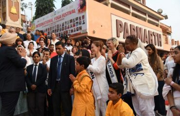 Governor meets and interacts with international yoga practitioners.