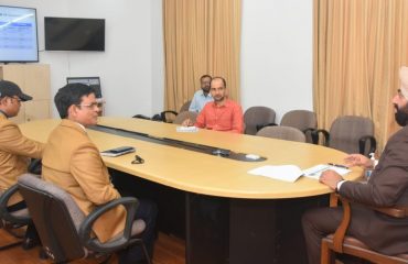 Mr. Devanand, Assistant Director of Narcotics Control Bureau (NCB), Sub-Regional Office, gives a presentation of the activities of the Institute, to Governor at the Raj Bhawan Secretariat.