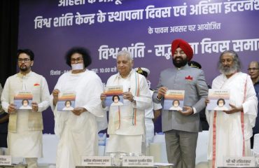 Governor releasing the booklet 'Ambassador of Peace' on the occasion of a program organized by Ahimsa Vishwabharti, in New Delhi.