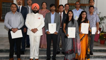 Governor Lt. Gen. Gurmit Singh (Retd) with meritorious students and research scholars.