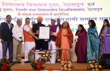 Governor releasing the book on the occasion of the seminar.