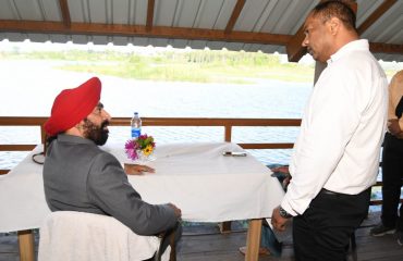 Governor in conversation with GMVN officer during the Asaan barrage tour.