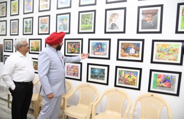 Governor Lt. Gen. Gurmit Singh (Retd) observes the exhibition put up by the students.
