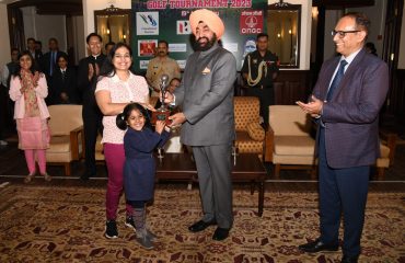 Governor presenting trophy to the winners of 18th Governors Cup Golf Tournament.