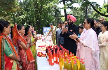 Governor along with First Lady Smt. Gurmeet Kaur, view the exhibition of products made by women of self-help groups.