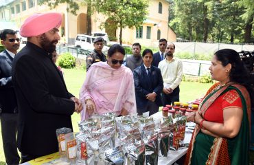 Governor along with First Lady Smt. Gurmeet Kaur, view the exhibition of products made by women of self-help groups.