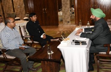 Governor meeting the SDM, Tehsildar and Revenue Sub-Inspector during his visit to Ramnagar.