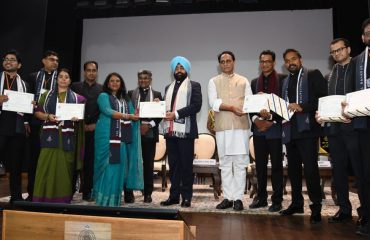 Governor felicitating the best trained participants in the program organized at Lal Bahadur Shastri National Academy of Administration, Mussoorie.