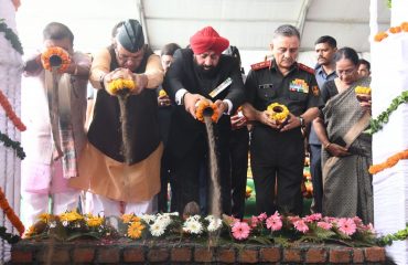 Governor Lt. Gen. Gurmit Singh (retd) places the holy soil brought from the martyrs' courtyard at SainyaDham, Guniyal village, Dehradun.
