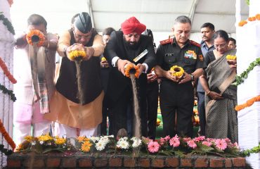 Governor Lt. Gen. Gurmit Singh (retd) places the holy soil brought from the martyrs' courtyard at SainyaDham, Guniyal village, Dehradun.
