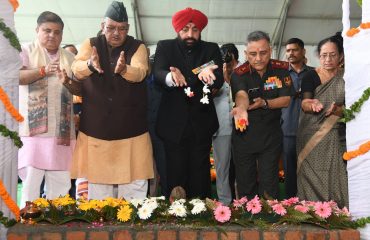 Governor Lt. Gen. Gurmit Singh (retd) places the holy soil brought from the martyrs' courtyard at SainyaDham, Guniyal village, Dehradun.
