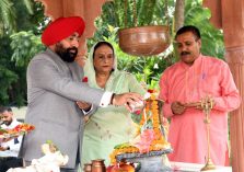 On the occasion of Harela festival, Governor Lt. Gen. Gurmeet Singh (Retd) offers prayers with his family at the Shiva temple at Raj Bhawan.;?>