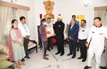 Governor distributes monthly nutrition kits to TB patients adopted under the National Tuberculosis Eradication Program at Raj Bhawan.