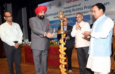 Governor Lt. Gen. Gurmit Singh (Retd) inaugurates the School Education Department's Continued Learning Access Project (CLAP) by lighting the lamp.