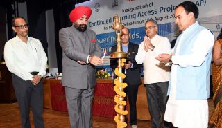 Governor Lt. Gen. Gurmit Singh (Retd) inaugurates the School Education Department's Continued Learning Access Project (CLAP) by lighting the lamp.