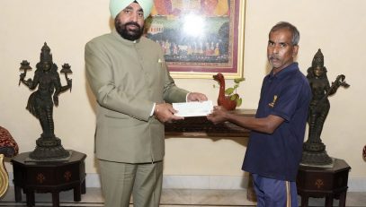 Governor Lt Gen Gurmit Singh (Retd) rewards the daily workers working in Raj Bhawan household establishment and garden