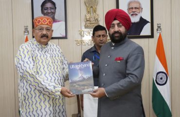 Tourism Minister Satpal Maharaj presents a book on tourism development to Governor Lt Gen Gurmit Singh (Retd) at Raj Bhawan.