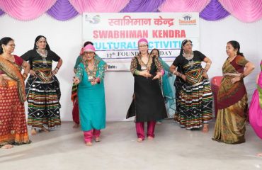 Women presenting group dance in a program organized in Garhi Cantt.