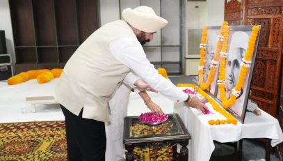 Governor Lt Gen Gurmit Singh (Retd) pays tribute by offering flowers on the portraits of Father of the Nation Mahatma Gandhi and former Prime Minister Shri Lal Bahadur Shastri.