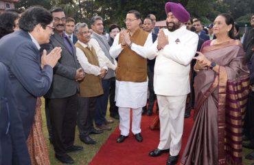 Governor meeting Chief Minister Pushkar Singh Dhami and other dignitaries on the occasion of High Tea program.