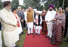 Governor meeting Chief Minister Pushkar Singh Dhami and other dignitaries on the occasion of High Tea program.;?>