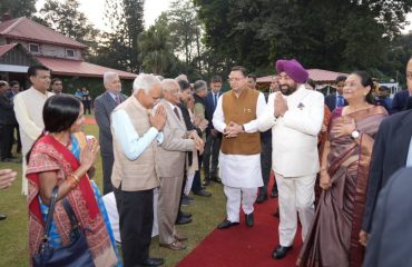 Governor meeting Chief Minister Pushkar Singh Dhami and other dignitaries on the occasion of High Tea program.