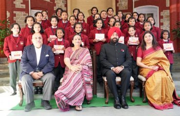 Governor Lt Gen Gurmit Singh (Retd) with the girls of Him Jyoti School at Raj Bhawan.