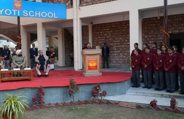 The Governor listening to the presentation being sung by the girl students of Him Jyoti School.