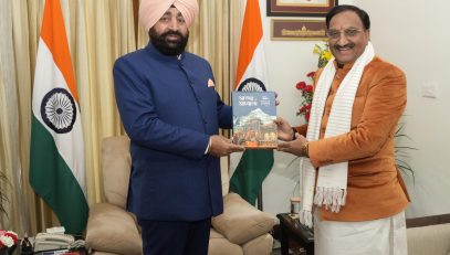 Former Chief Minister and current MP from Haridwar Lok Sabha constituency Dr. Ramesh Pokhriyal "Nishank" presenting his book "Faith and Spirituality" to the Governor.