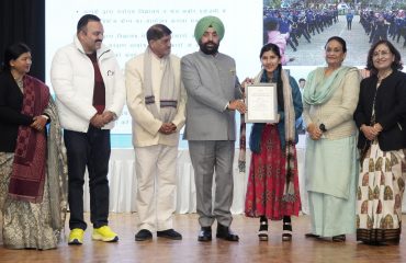 Governor honoring girls for bravery on the occasion of 'National Girl Child Day'.