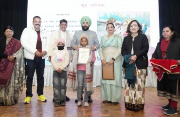 Governor honoring girls for bravery on the occasion of 'National Girl Child Day'.