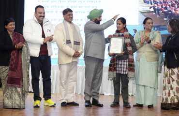 Governor honoring girls for bravery on the occasion of 'National Girl Child Day'.