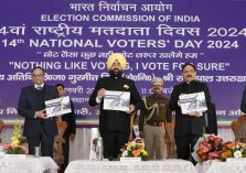 Governor releasing the coffee table book on the occasion of 'National Voters' Day'.;?>