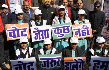 Governor with girl students on the occasion of ‘National Voters Day’.