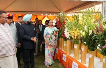 Governor visiting the grand exhibition of flowers and getting information.