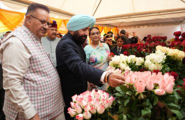 Governor visiting the grand exhibition of flowers and getting information.