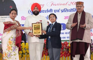 Governor rewarding the winners at the closing ceremony of Vasantotsav.