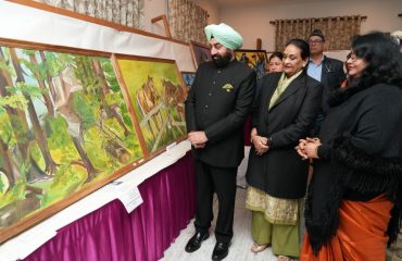Governor inspecting the art gallery and photo exhibition at Raj Bhawan.