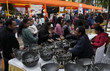 People making purchases after getting information about the products displayed in the stalls.