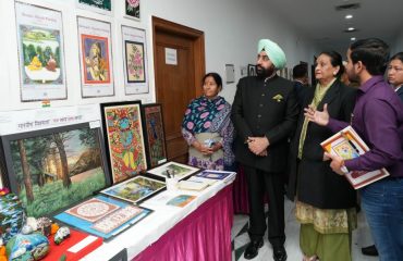 Governor inspecting the art gallery and photo exhibition at Raj Bhawan.