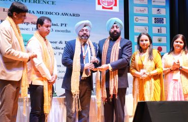 Governor honoring the physiotherapist doctor for his meritorious services.