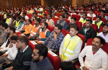 Beneficiaries and other personnel of the scheme watching the screening of the National Action for Mechanized Sanitation Ecosystem (Namaste) program.