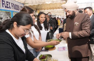 Governor visiting millet stalls and getting information.