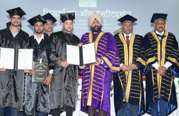 Governor awarding degrees to students.