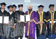 Governor awarding degrees to students.;?>