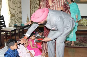 Governor worshiping the girls embodying the goddess along with their family on the occasion of Durga Ashtami of Chaitra Navratri.