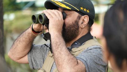 Governor observing birds during a bird-watching session in the Rajbhawan premises.